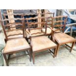 A set of six George III mahogany ladderback dining chairs with leather drop in seats (one with