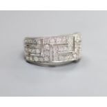A modern 18ct white gold and diamond set 'Greek Key' dress ring, size P/Q, gross weight 5.4 grams.