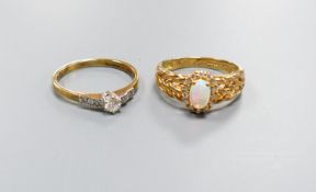 A modern 9ct gold, white opal and diamond set oval cluster ring, size M and a similar single stone