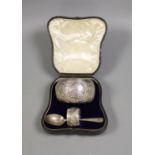 A Victorian cased matched embossed silver christening trio, comprising , bowl, napkin ring and