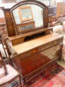 An Edwardian Art Nouveau inlaid mahogany dressing chest, width 122cm, depth 55cm, height 160cm