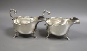 A pair of Edwardian silver sauceboats, with flying scroll handles, Henry Stratford Ltd, Sheffield,