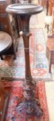 A late Victorian carved mahogany torchere, height 120cm