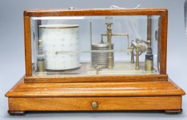 A mahogany cased barograph by Negretti & Zambra No C.13658 with spare graph paper in drawer37cm