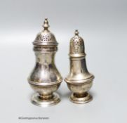 A Victorian silver baluster pepper pot, Charles Stuart Harris, London 1897, 11.2cm and an Edwardian