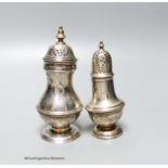 A Victorian silver baluster pepper pot, Charles Stuart Harris, London 1897, 11.2cm and an Edwardian