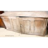 A Victorian pine two door low cupboard, width 122cm, depth 32cm
