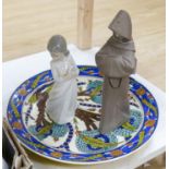 A Lladro figure of a monk, a Nao figure of a girl and an Isnik style dish (3)