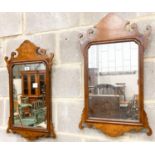 A pair of 18th century style walnut fret cut wall mirrors, width 42cm, height 70cm