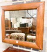 A late Victorian antique style pine cushion mirror, width 70cm, height 66cm