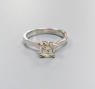 A modern white gold and solitaire diamond ring, size N, gross weight 4.6 grams,the stone weighing