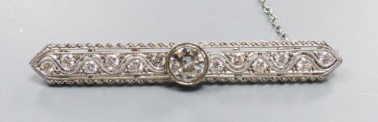 A modern Belle Epoque style pierced 750 white metal and diamond set bar brooch, 58mm, gross weight