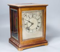 A chiming 4 glass mahogany mantel clock, retailed by Birch and Gaydon with silvered dial, 26.5 cm