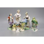 Three Continental figures and a collection of bird ornaments, tallest 22cm