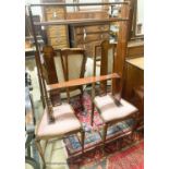 An Edwardian Art Nouveau inlaid mahogany towel rail and a pair of matching salon chairs (3)