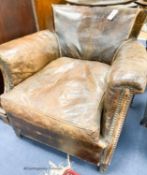An early 20th century brown leather club armchair, width 78cm, depth 70cm, height 71cm