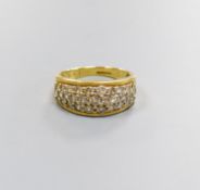 A modern 18ct gold and diamond encrusted half hoop ring, total diamond weight approx. 1.00ct, size