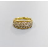 A modern 18ct gold and diamond encrusted half hoop ring, total diamond weight approx. 1.00ct, size