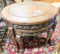 A Chinese circular carved hardwood circular low table with a burr wood centre panel and companion