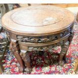 A Chinese circular carved hardwood circular low table with a burr wood centre panel and companion