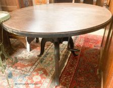 An industrial style circular oak adjustable table, diameter 100cm