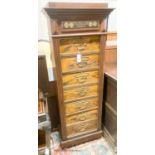 A late 19th / early 20th century oak and simulated walnut shop storage chest / filing cabinet,