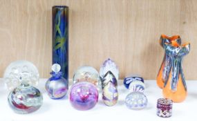 A group of 20th century glass paperweights and studio glass vases, Tallest 24 cm high