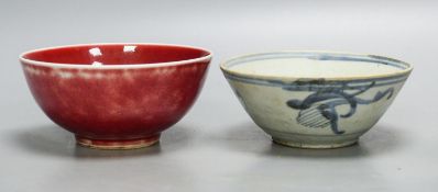 A Chinese sang de boeuf bowl and a blue and white bowl, 12.7cm