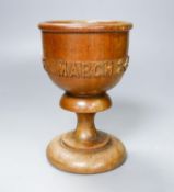 A turned and carved wood goblet made from the timber of the ship Eurydice and dated March 24th