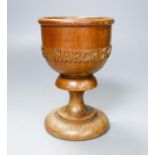 A turned and carved wood goblet made from the timber of the ship Eurydice and dated March 24th