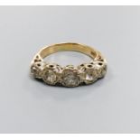 A five-stone diamond ring, 9ct white and yellow gold setting, claw-set with carved shoulders, size