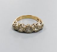 A five-stone diamond ring, 9ct white and yellow gold setting, claw-set with carved shoulders, size
