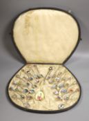 A set of 22 Swiss 800 silver and enamel souvenir spoons, each representative of a Canton, cased,
