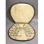 A set of 22 Swiss 800 silver and enamel souvenir spoons, each representative of a Canton, cased,