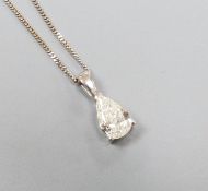 A modern white metal and solitaire pear shaped diamond set pendant, overall 14mm, on and 18ct white
