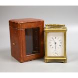 An early 20th century French brass carriage clock with alarm, 16cm high handle up, cased