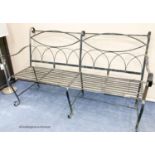 A painted wrought iron garden bench, length 175cm, depth 83cm, height 110cm