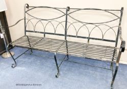 A painted wrought iron garden bench, length 175cm, depth 83cm, height 110cm