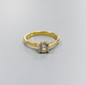 A modern 18ct gold and solitaire diamond ring, size O, gross 3.2 grams,the stone weighing approx.