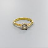 A modern 18ct gold and solitaire diamond ring, size O, gross 3.2 grams,the stone weighing approx.