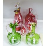 A collection of Mary Gregory cranberry and green glass decanters, jug etc (9), tallest 28.5 cm