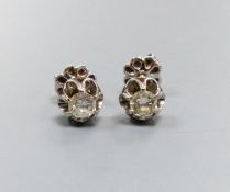A pair of white metal and solitaire diamond set ear studs, each stone approx. 0.20ct, gross weight