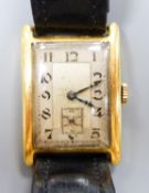 A gentleman's 1930's 18ct gold Aster manual wind rectangular dial wrist watch, on a leather strap,