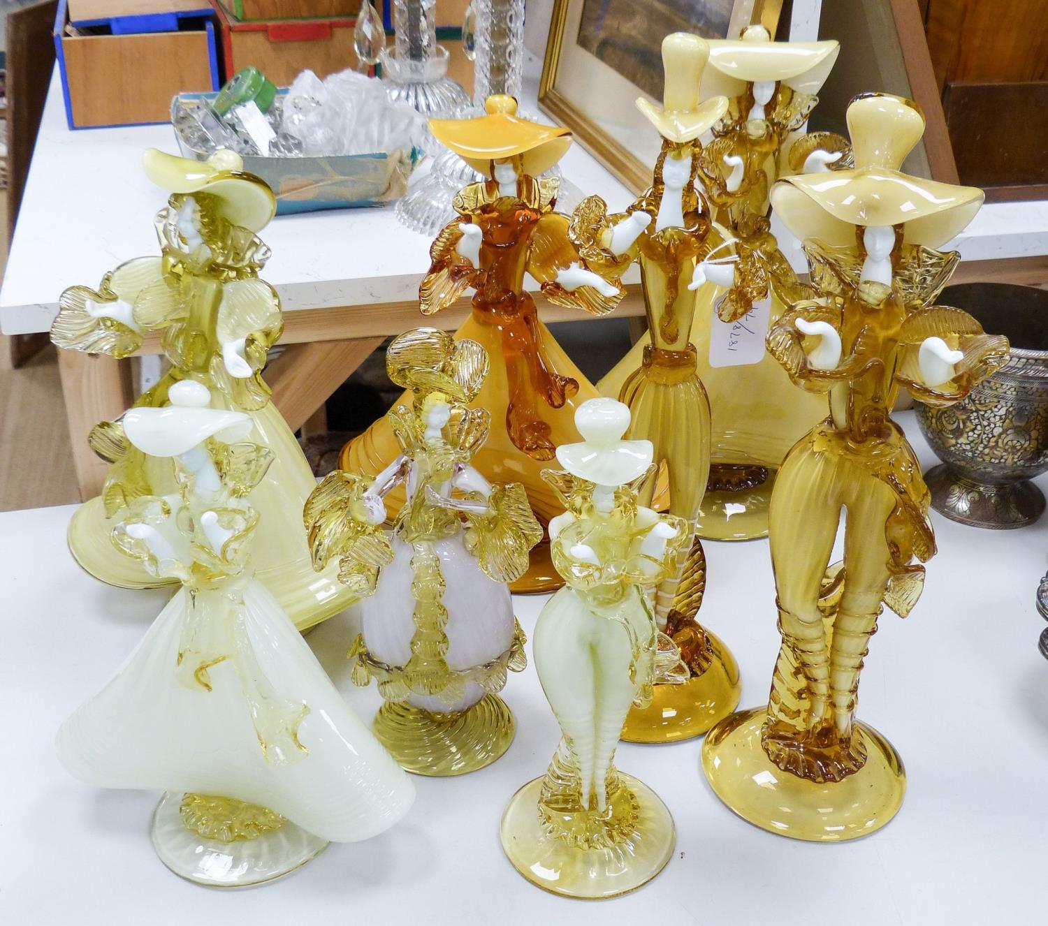 A collection of eight Murano amber glass figures, tallest 42cm