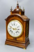 A French flame mahogany and satinwood banded bracket clock retailed by J.W Benson56cm