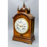 A French flame mahogany and satinwood banded bracket clock retailed by J.W Benson56cm