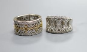Two modern pierced yellow and white metal, diamond chip cluster rings, sizes K M, gross weight 18.9