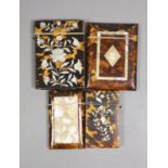 Four Victorian tortoiseshell and mother of pearl card cases, largest 10.5 cm