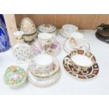 A group of Dresden and Continental porcelain cups and saucers boxes and covers and a scent bottle,