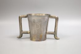 A stylish late Victorian planished Brittania standard silver two handled mug, Hamilton & Inches,
